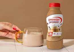 a bottle of Premier Protein next to a glass