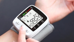 a blood pressure monitor on a wrist