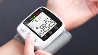 a blood pressure monitor on a wrist