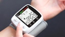 a blood pressure monitor on a wrist