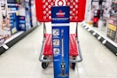 bissell stick vacuum sitting in front of a target cart