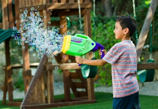 child holding the Gazillion Bubble Blaster
