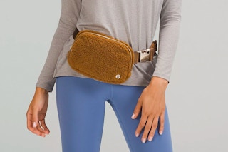 A lululemon model wearing a brown everywhere belt bag