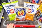 skinnypop and pirates booty popcorn bags in a cart