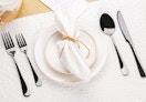 black silverware on a set table 