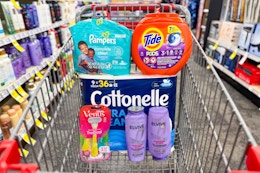pampers wipes, tide pods, cottonelle toilet paper, venus razors, and loreal elvive shampoo in a cart