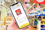 hand holding a smartphone displaying a Tyson Chicken kcl coupon