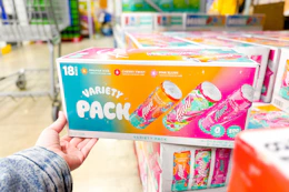 hand holding alani nu drinks variety pack