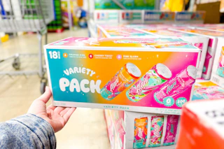 hand holding alani nu drinks variety pack