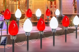 Albelt 12 Pack Jumbo C9 Solar Christmas Lights outside during winter at night.