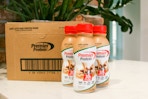 premier protein shakes next to box