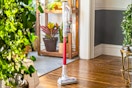 Stock image of the Bissell stick vacuum in home setting