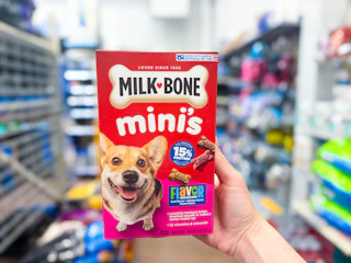 A box of Milk Bone Minis held up in Walmart store