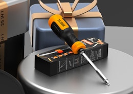 a screwdriver on a box on a table