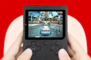 someone holding a retro gaming console