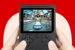 someone holding a retro gaming console