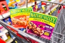 2 boxes of nature valley granola bars in a cart