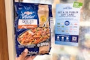 publix birds eye voila beef lo mein handheld near a sign by the freezer