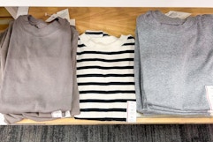 women's tees and tank tops sitting on a target shelf