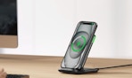 a phone on a wireless charger on a table 