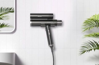 a dual hair dryer against a wall