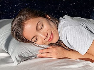A woman sleeping on a Beckham Hotel Collection pillow.