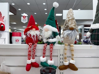 three christmas gnomes decor sitting on a shelf