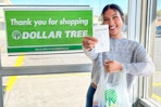 a person holding up a dollar tree receipt