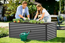 Lifestyle image of a raised garden bed being used outdoors by two people