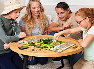 four people playing the Jumanji board game