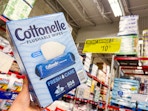 hand holding a box of cottonelle wipes