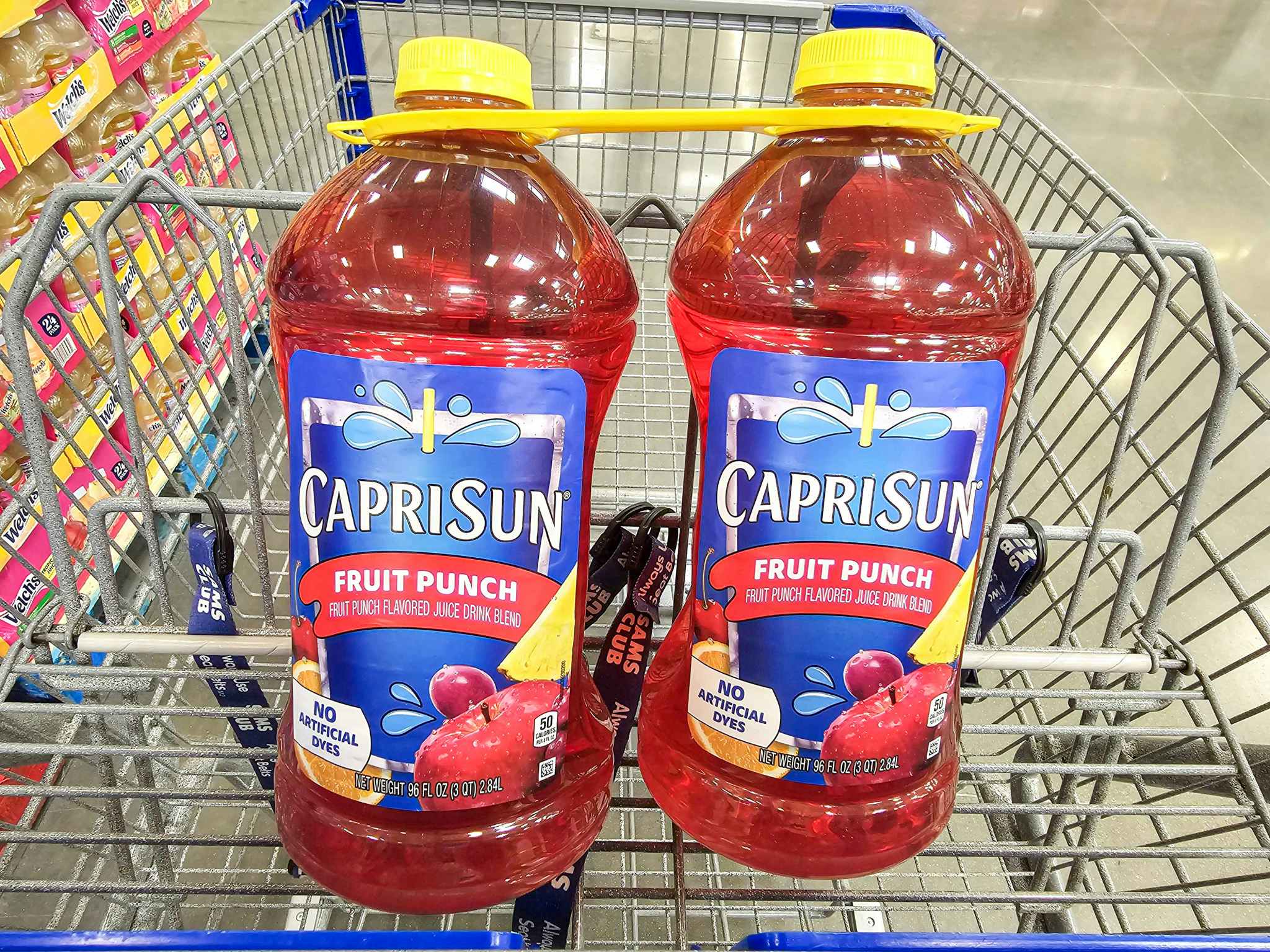 2 large jugs of capri sun in a cart