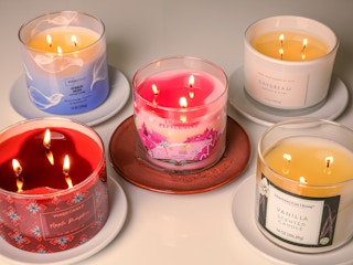 Five candles from different stores being burned