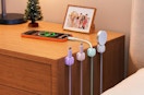 pastel cord organizers against a nightstand with cords