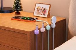 pastel cord organizers against a nightstand with cords