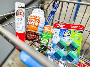 Colgate toothbrush, Dunkin cold brew, Purina dog chow & Soft Scrub cubes in Walmart shopping cart