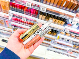 hand holding cosmetics in walgreens