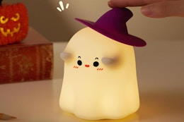 a ghost night light on a table