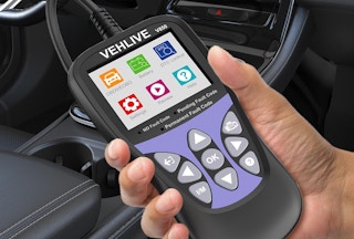 a hand holding a check engine light tool