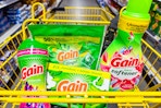 gain flings, fabric softener, dryer sheets, fireworks in a yellow shopping cart