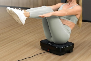 a woman using a vibration plate