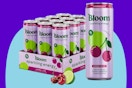 Bloom Nutrition Energy Drink 12-Pack Cherry Lime on a purple background.