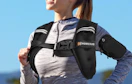 a woman running with a weighted vest 