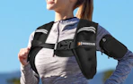 a woman running with a weighted vest