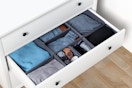 Drawer organizer with clothes in it