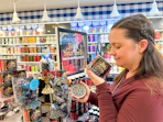 a person smelling a candle in bath and body works