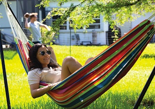 woman sitting in hammock
