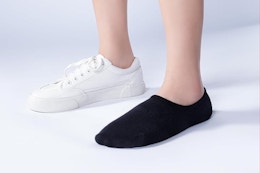 person wearing a shoe and a no show sock