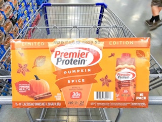 pumpkin spice premier protein drinks in a cart