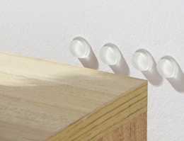 silicone bumps on the wall behind a shelf